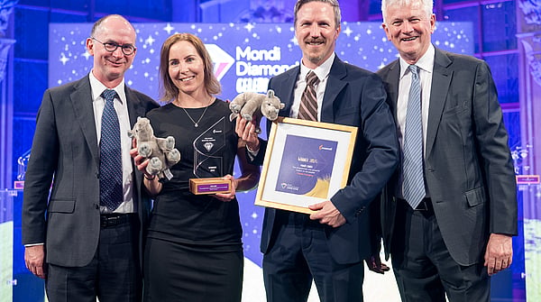 Photograph from Mondi’s Diamond Awards showing Mondi's executive with the winners, holding the award and a certificate.